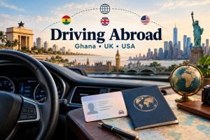 Driving abroad guide with a car steering wheel, licence and Ghana, UK and US flags